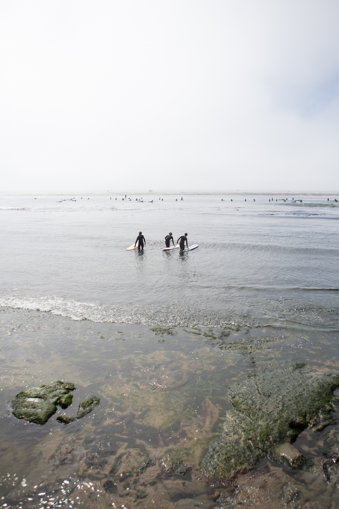 Surfers in pleasure point in Santa Cruz