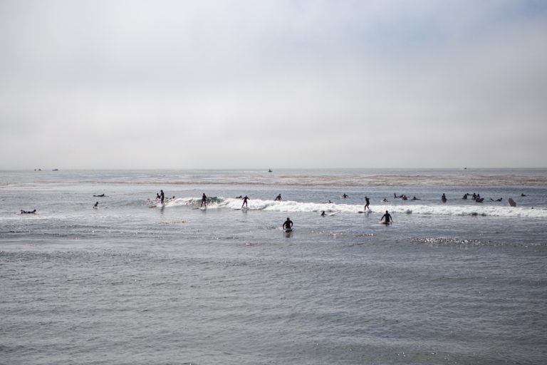 Surfers in pleasure point in Santa Cruz